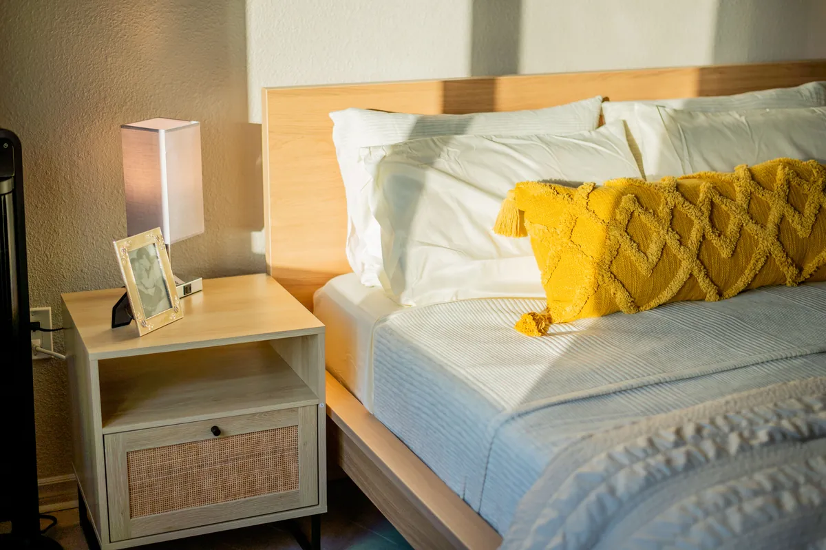 Queen bed made up with crisp white linen