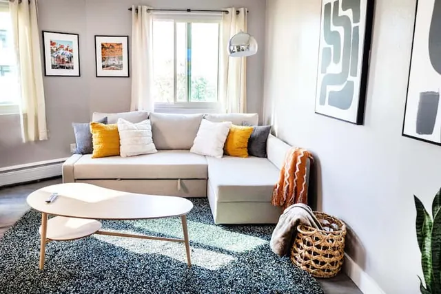 Living room with sectional sofa and framed art