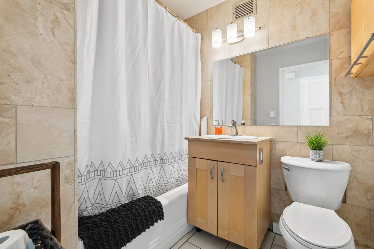 Bathroom with shower and vanity